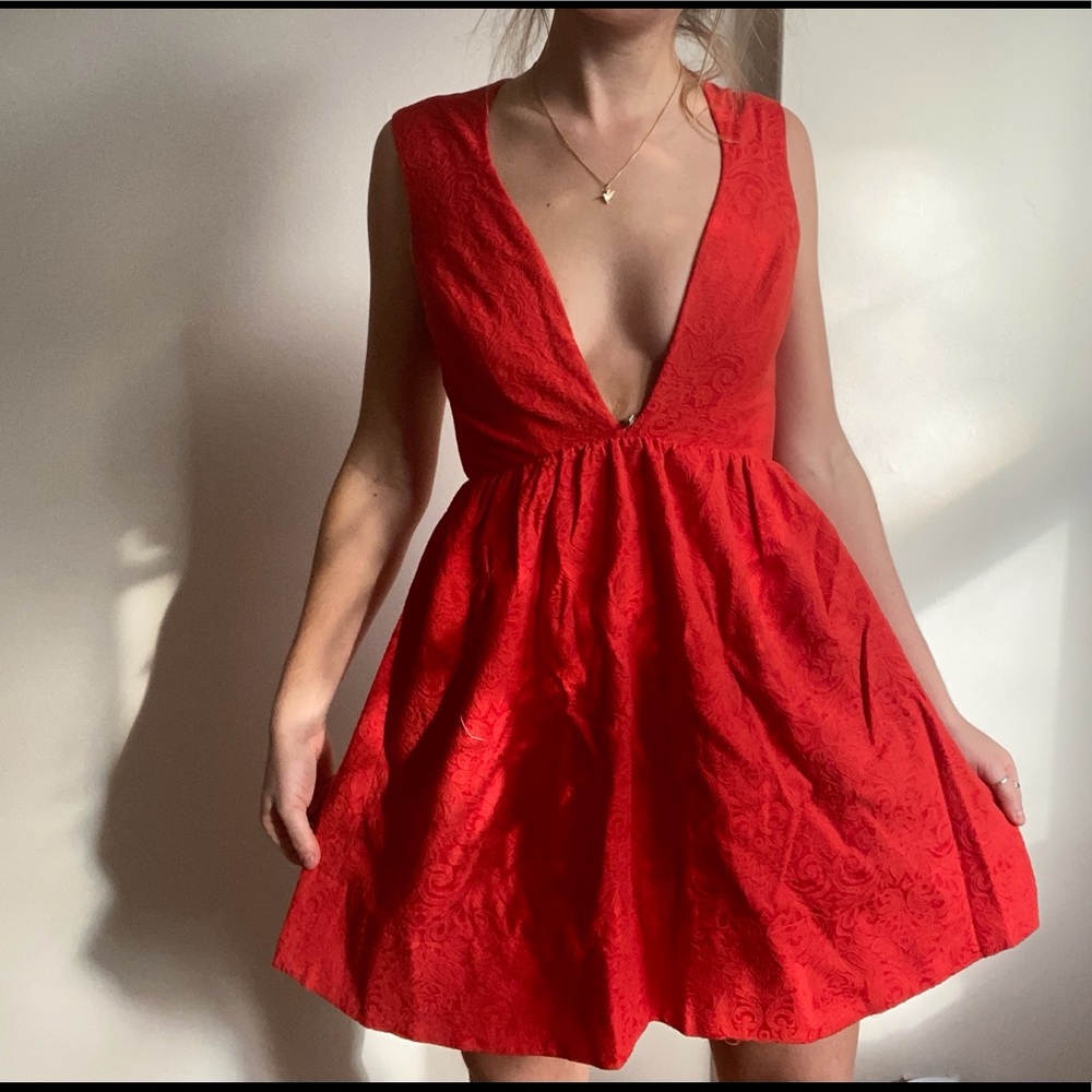 Red deep v fit and flare textures mini dress